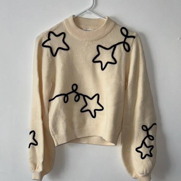 Storia Sweaters - Storia Cream Sweater with Black Star Accents